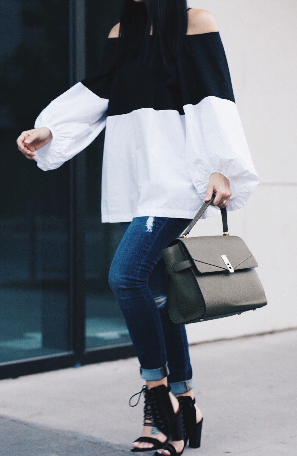 Olive Henri Bendel Bag, Black and White Top, Jeans