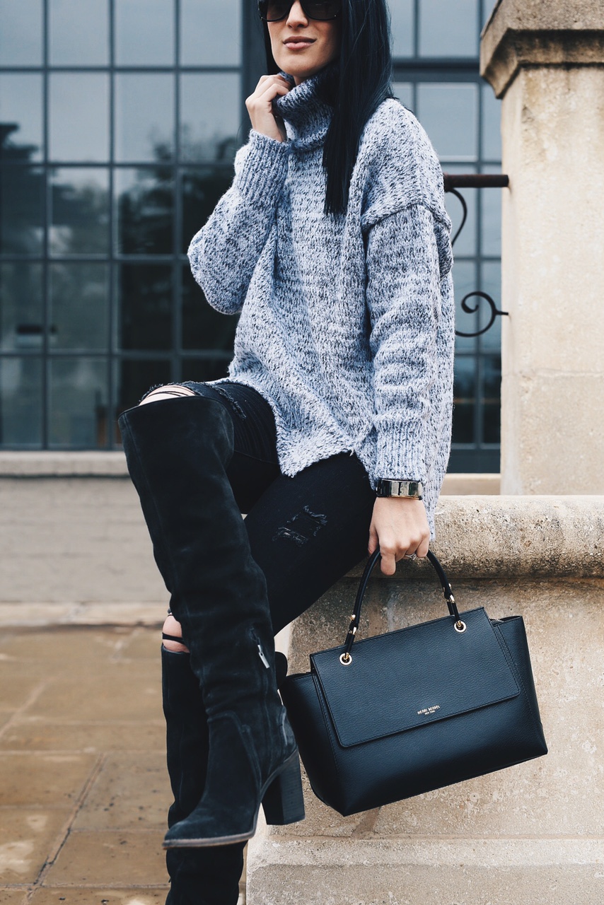 Ashley Hargrove of DTKAustin is wearing a Chicwish sweater, Henri Bendel Bag and Vince Camuto Boots
