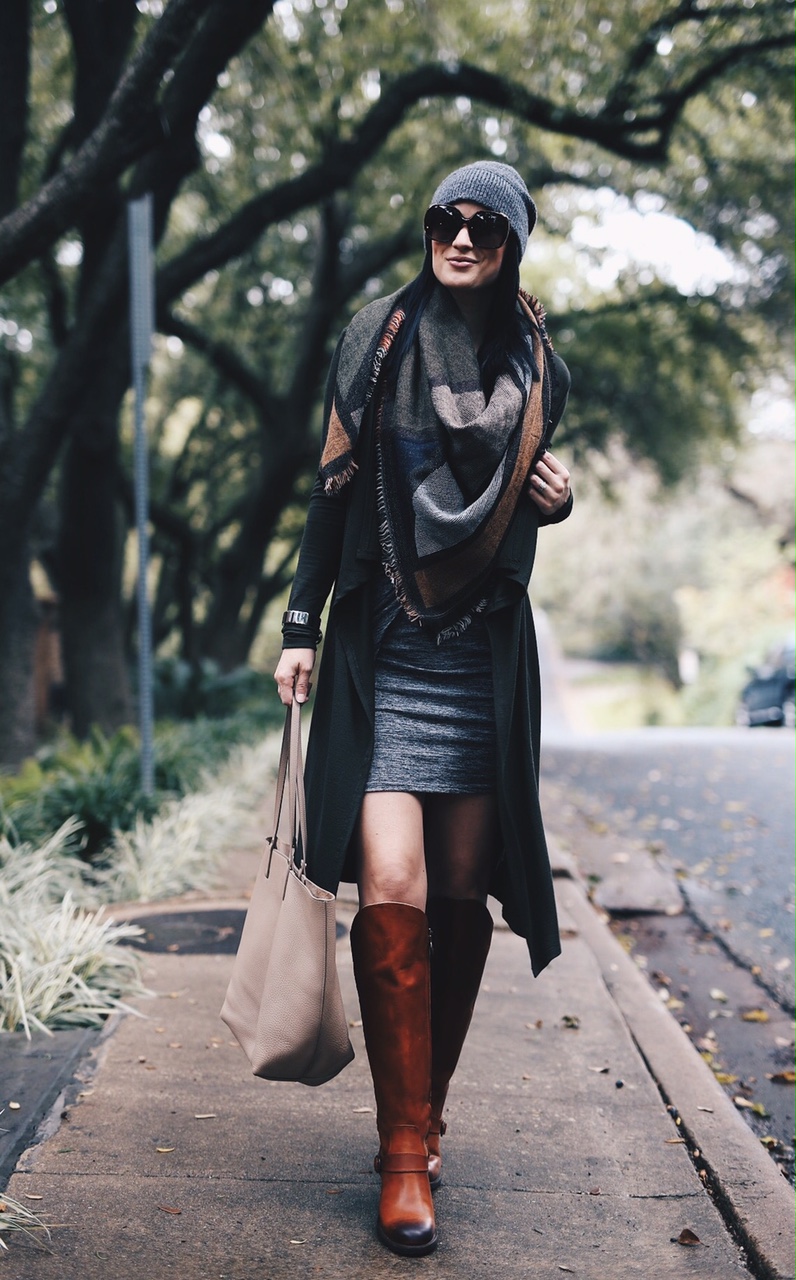Ashley Hargrove of DTKAustin is wearing Justin Boots, Blanket Scarf from Nordstrom, a Gigi New York Tori Tote and Rebecca Minkoff Beanie