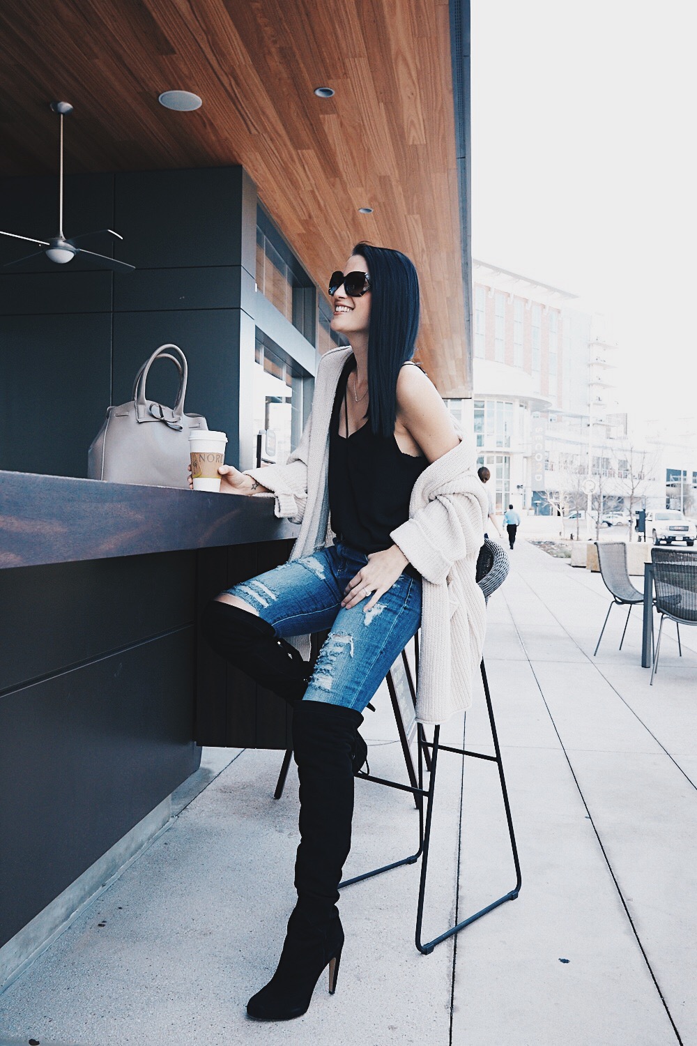 DTKAustin shows how to layer a cami with a knit cardigan and OTK boots for a cozy winter look. Click through for more outfit ideas!