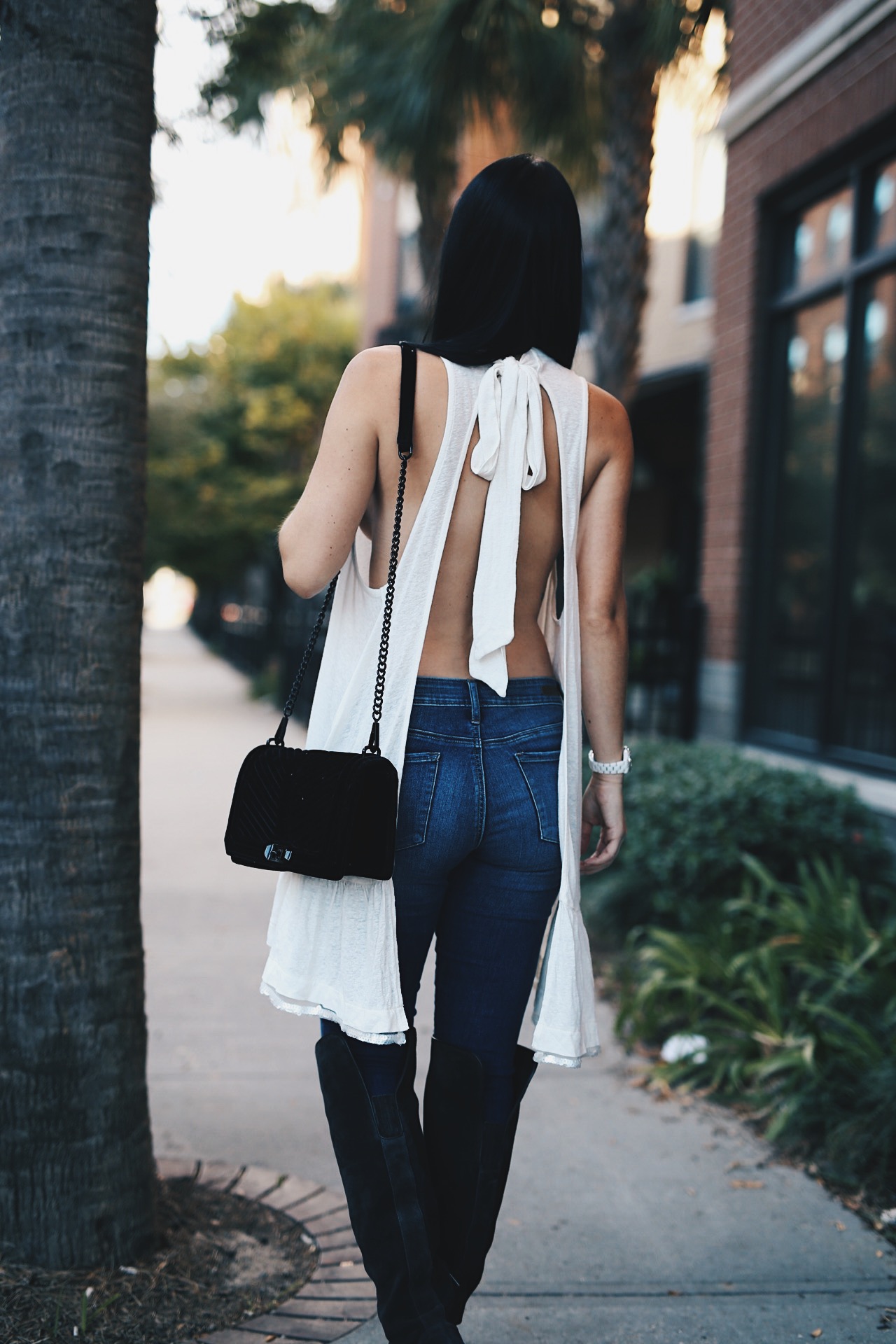DTKAustin is sharing her favorite white free people top shot while in New Orleans. Ashley is carrying a Rebecca Minkoff Love bag and wearing Vince Camuto OTK Boots. Click to get more info and pics!