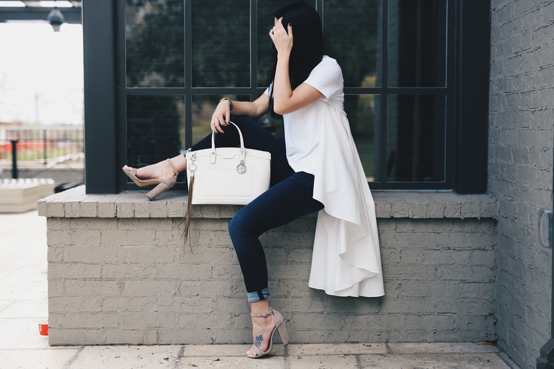 DTK Austin is celebrating her 31st birthday by sharing 31 facts about her life. Click for more outfit details - Blouse from Red Dress Boutique, Steve Madden heels, Articles of Society Jeans with a Henri Bendel Bag.