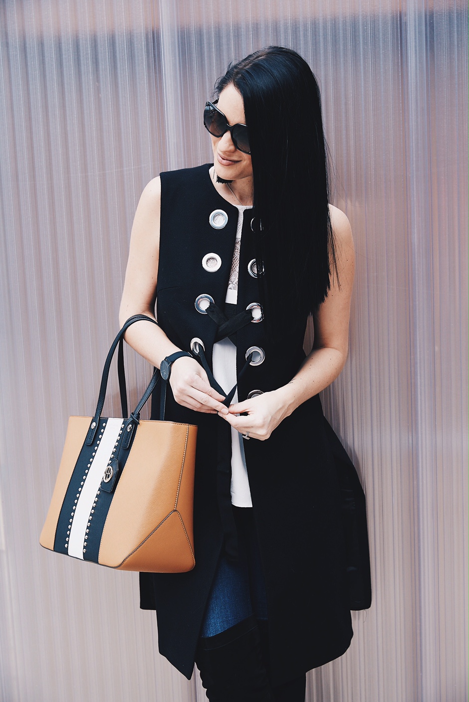 DTKAustin shows how to wear a vest to transition into Spring. Click for more details on this OOTD. Zara Vest, Henri Bendel Bag, and a CamiNYC tank.