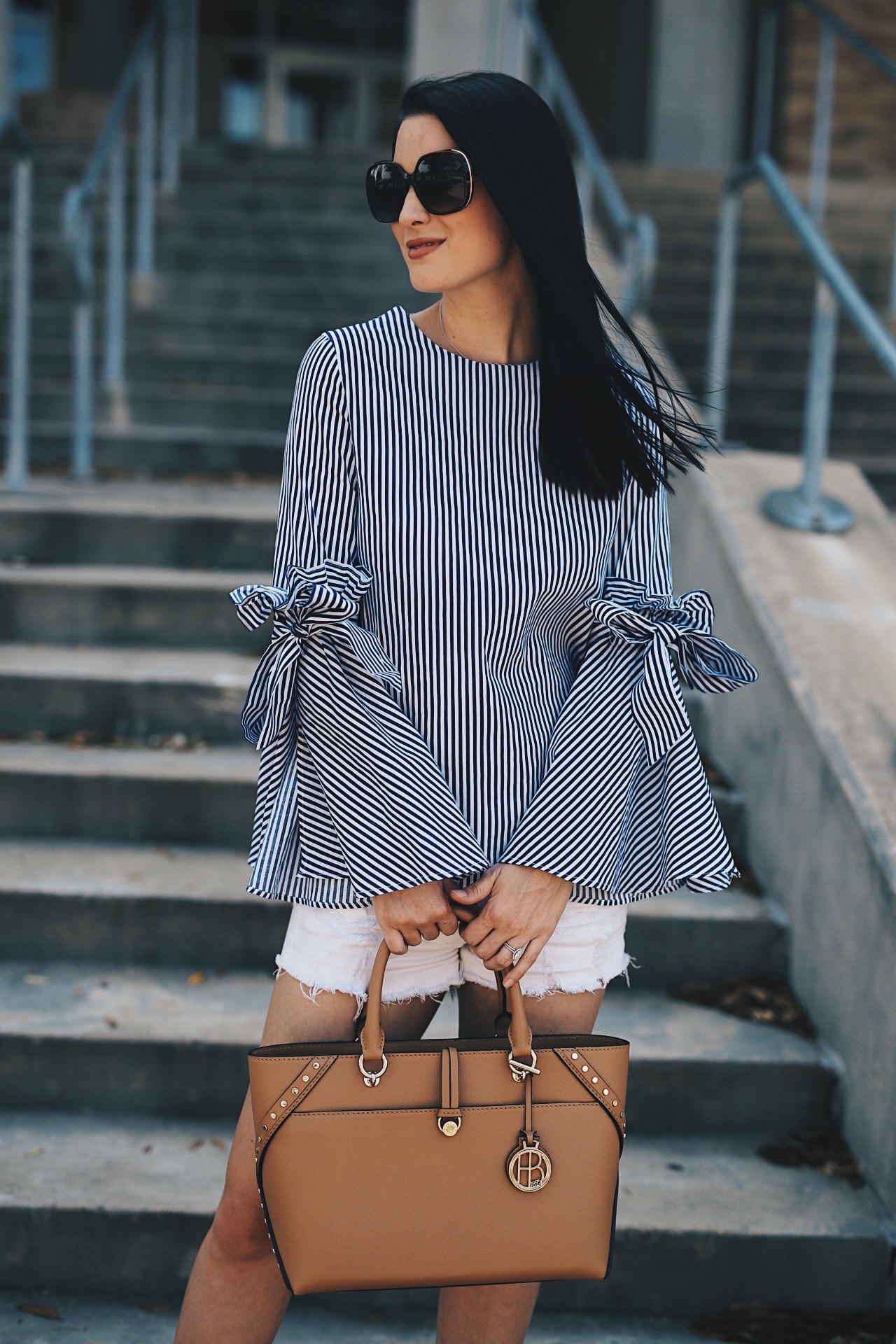 Ashley of DTK Austin shares her favorite summer bell-sleeved top from Chicwish with a Henri Bendel tote. Click for more information and photos of the perfect summer outfit.