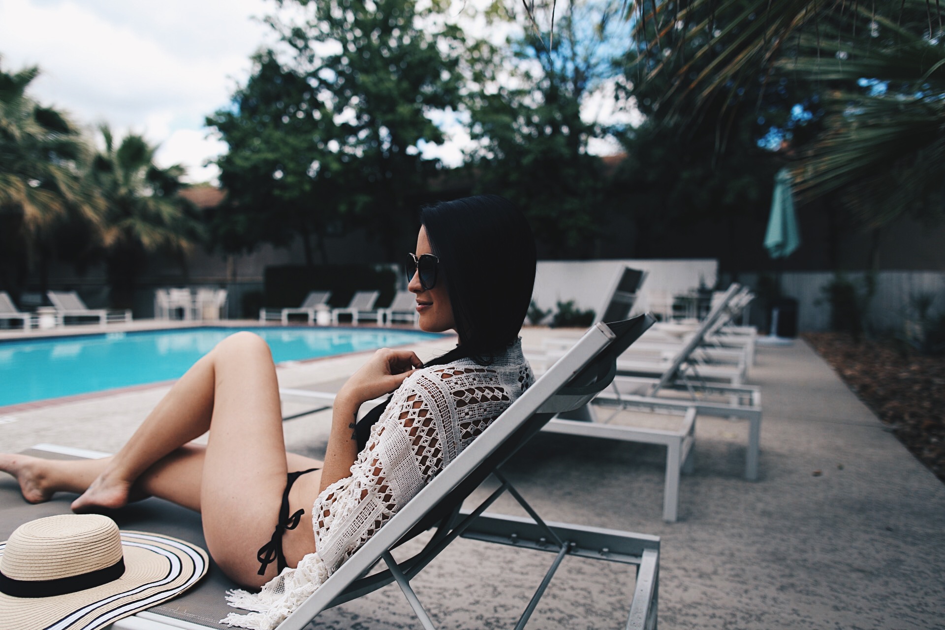 DTKAustin is sharing her pool day essentials and favorite affordable little black bikinis! Click for more pool day pics and outfit details.