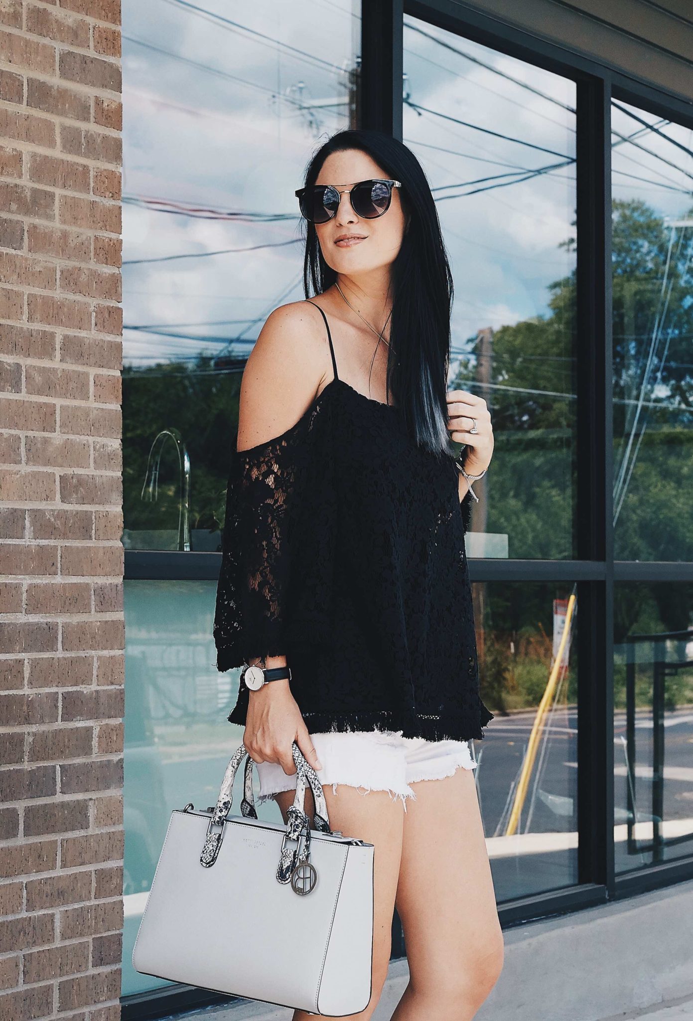 DTKAustin shares a beautiful black Bailey44 lace cold shoulder top, paired with white cutoff shorts, a Henri Bendel bag and Splendid black heels. Click for more information and photos. | how to style a cold shoulder top | how to wear a cold shoulder top | cold shoulder top style tips | summer fashion tips | summer outfit ideas | summer style tips | what to wear for summer | warm weather fashion | fashion for summer | style tips for summer | outfit ideas for summer || Dressed to Kill