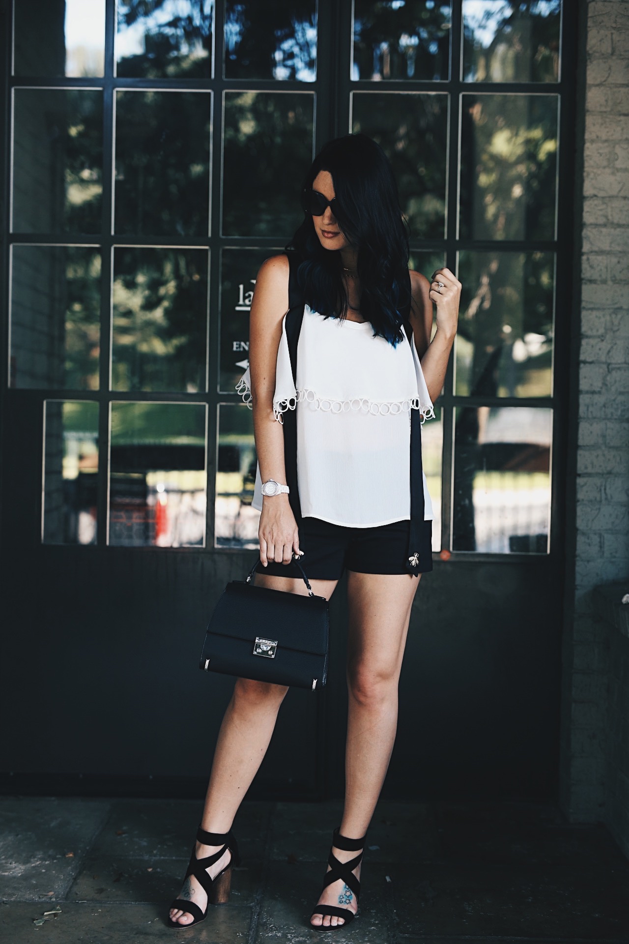 DTKAustin shares her love for black and white with this bee detailed top from Chicwish. Shoes from Splendid, Shorts from Alice & Olivia and bag from Henri Bendel. Click for more details and photos.  | how to style a cold shoulder top | how to wear a cold shoulder top | cold shoulder top style tips | summer fashion tips | summer outfit ideas | summer style tips | what to wear for summer | warm weather fashion | fashion for summer | style tips for summer | outfit ideas for summer || Dressed to Kill
