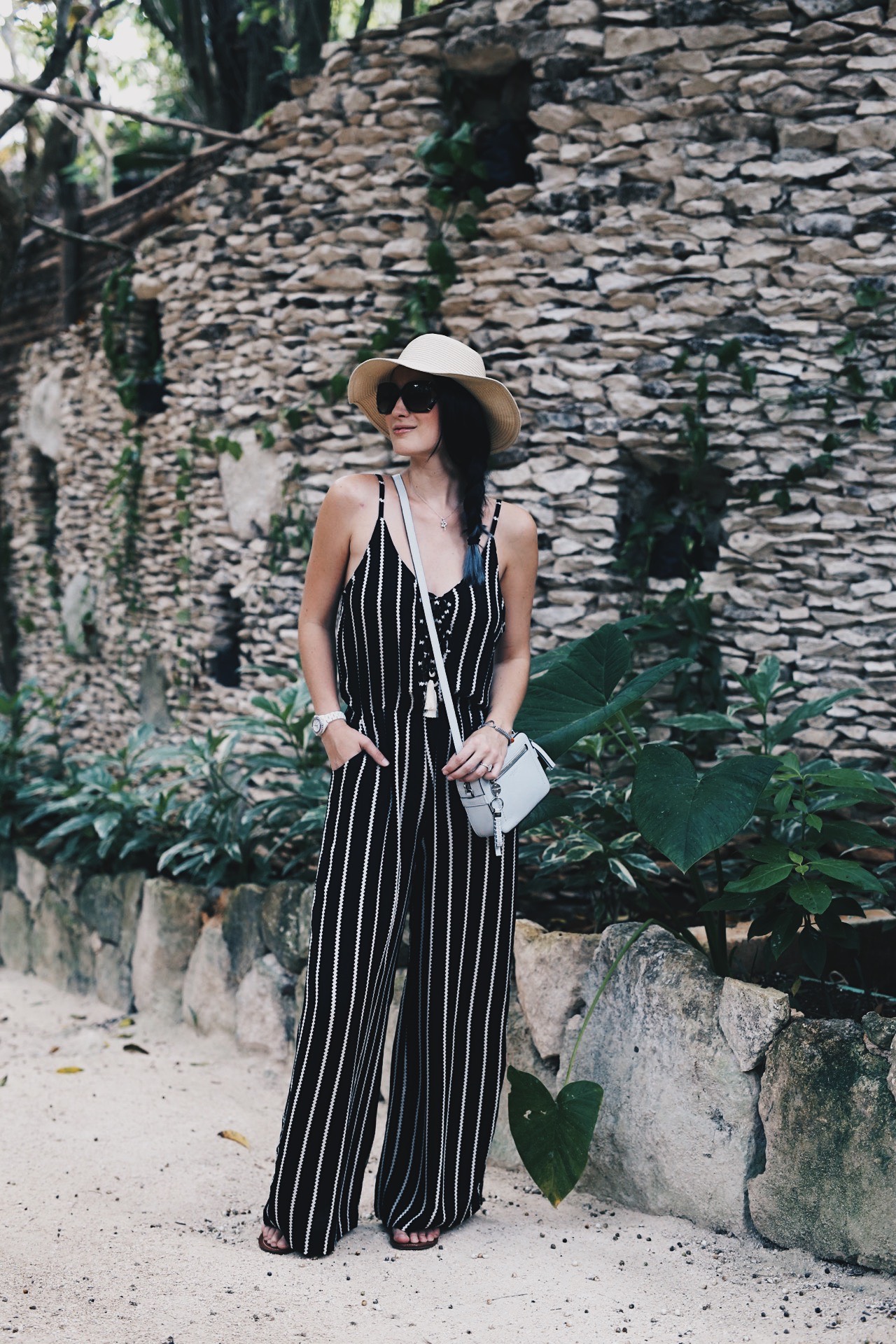 DTKAustin shares some of her recent photos from Tulum, Mexico with ideas on what to wear to beat the heat in the jungle or on the beach. Jumpsuit from Wala Swim, Bag from Henri Bendel. Click for more images and information. | how to style a jumpsuit | how to wear a jumpsuit | jumpsuit styling tips | summer fashion tips | summer outfit ideas | summer style tips | what to wear for summer | warm weather fashion | fashion for summer | style tips for summer | outfit ideas for summer || Dressed to Kill