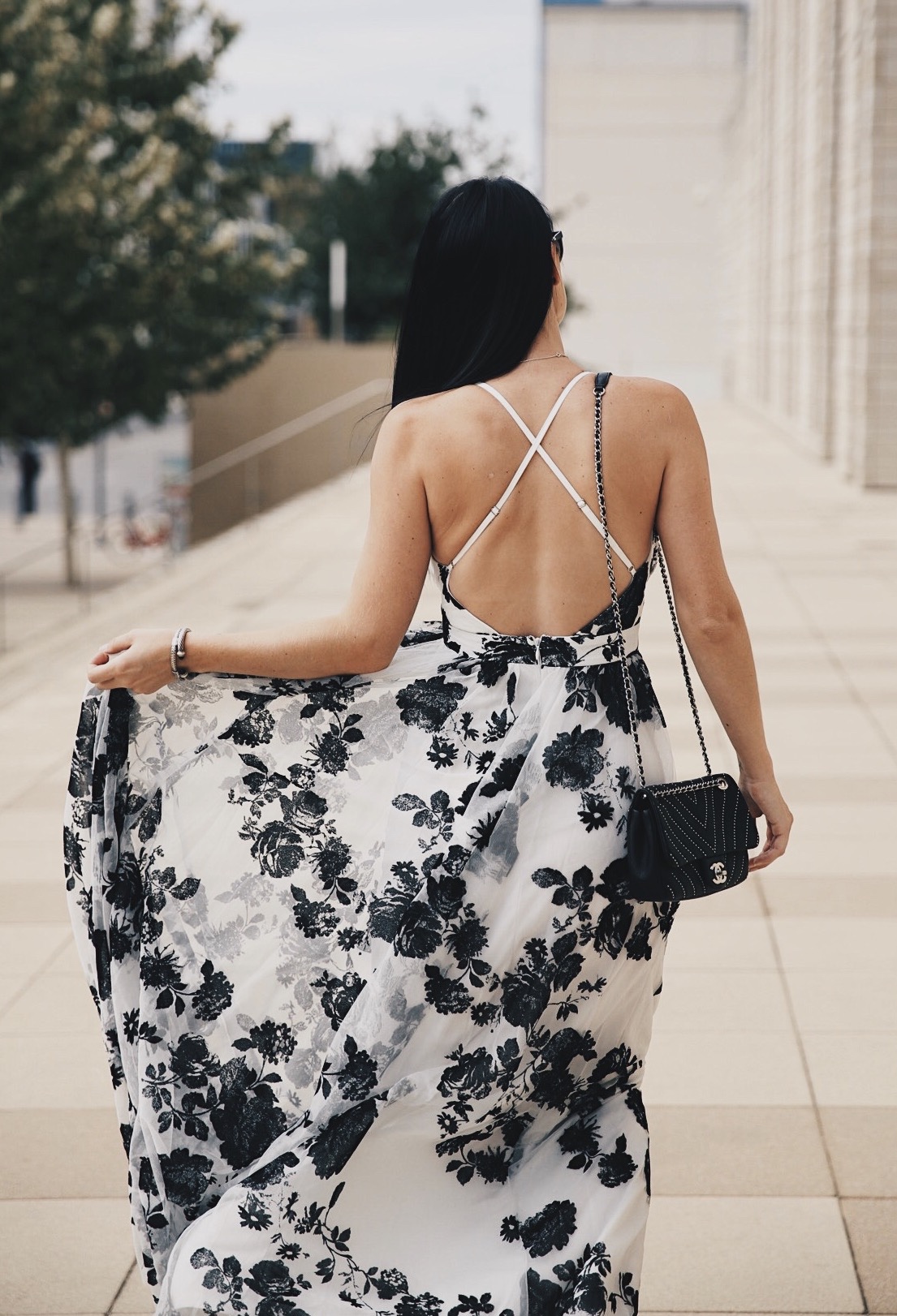 DTKAustin shares the most affordable black and white floral print maxi dress from Akira. Under $100 with a stunning criss-cross back it is perfect for date night. | how to wear a maxi dress | how to style a maxi dress | maxi dress style tips | summer fashion tips | summer outfit ideas | summer style tips | what to wear for summer | warm weather fashion | fashion for summer | style tips for summer | outfit ideas for summer || Dressed to Kill