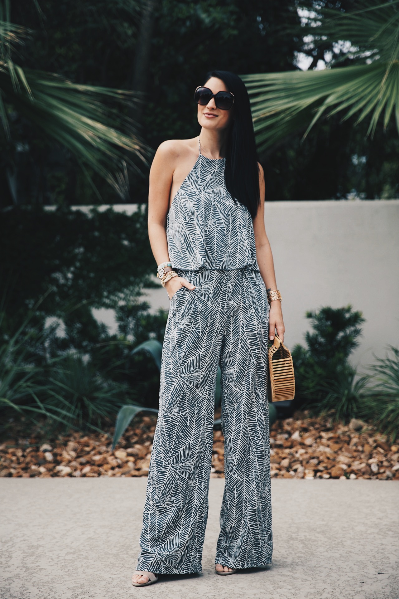 DTKAustin shares details on one of her go-to women's boutiques; Red Dress Boutique along with this beautiful palm print jumpsuit and Japanese bamboo bag. | how to style a jumpsuit | how to wear a jumpsuit | fall fashion tips | fall outfit ideas | fall style tips | what to wear for fall | cool weather fashion | fashion for fall | style tips for fall | outfit ideas for fall || Dressed to Kill