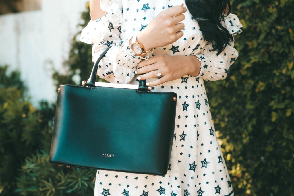 DTKAustin talks Spring looks and outfits with one of her favorite designers, Ted Baker. Star print dress, leather tote and leather sandals all Ted Baker. - Ted Baker Dress styled by popular Austin fashion blogger Dressed to Kill