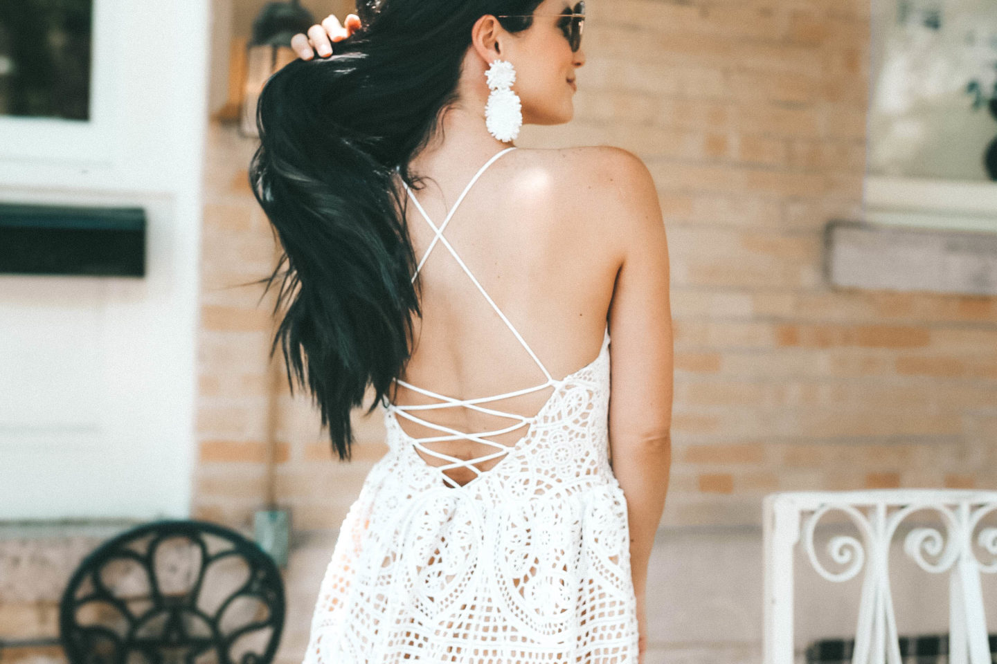 DTKAustin shares her must have white lace, crochet dress for summer from Chicwish. Beautiful lace up back detail with Baublebar statement earrings.