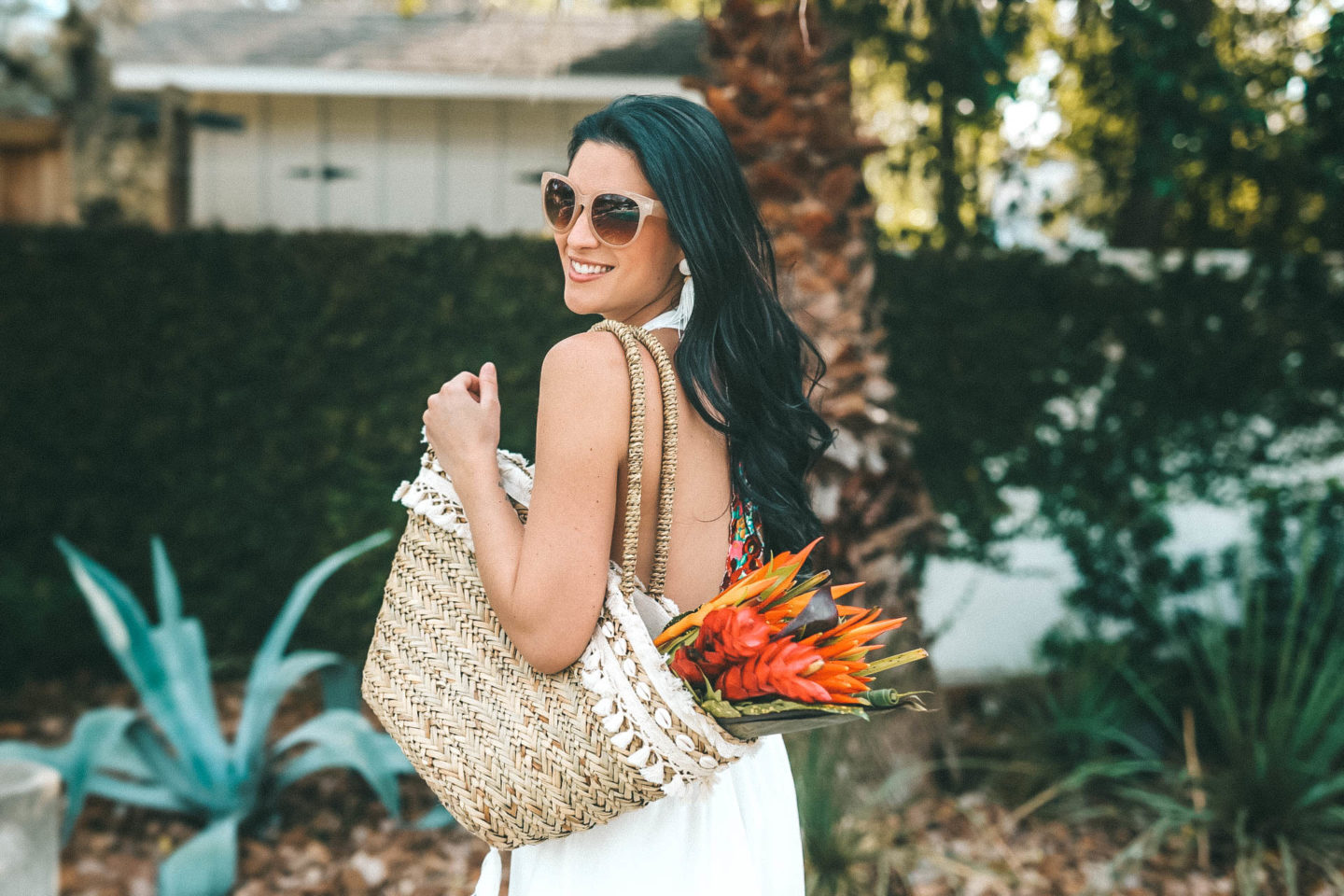 DTKAustin shares her favorite vacation maxi dress and swim coverup from Show Me Your Mumu that is 50% off on sale. Straw bag is from Express and the bouquet is from The Bouqs.