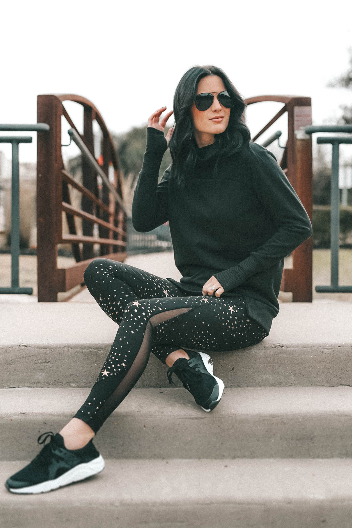 Affordable Activewear featured by top US fashion blog Dressed to Kill; Women wearing Walmart workout legging sitting on steps.