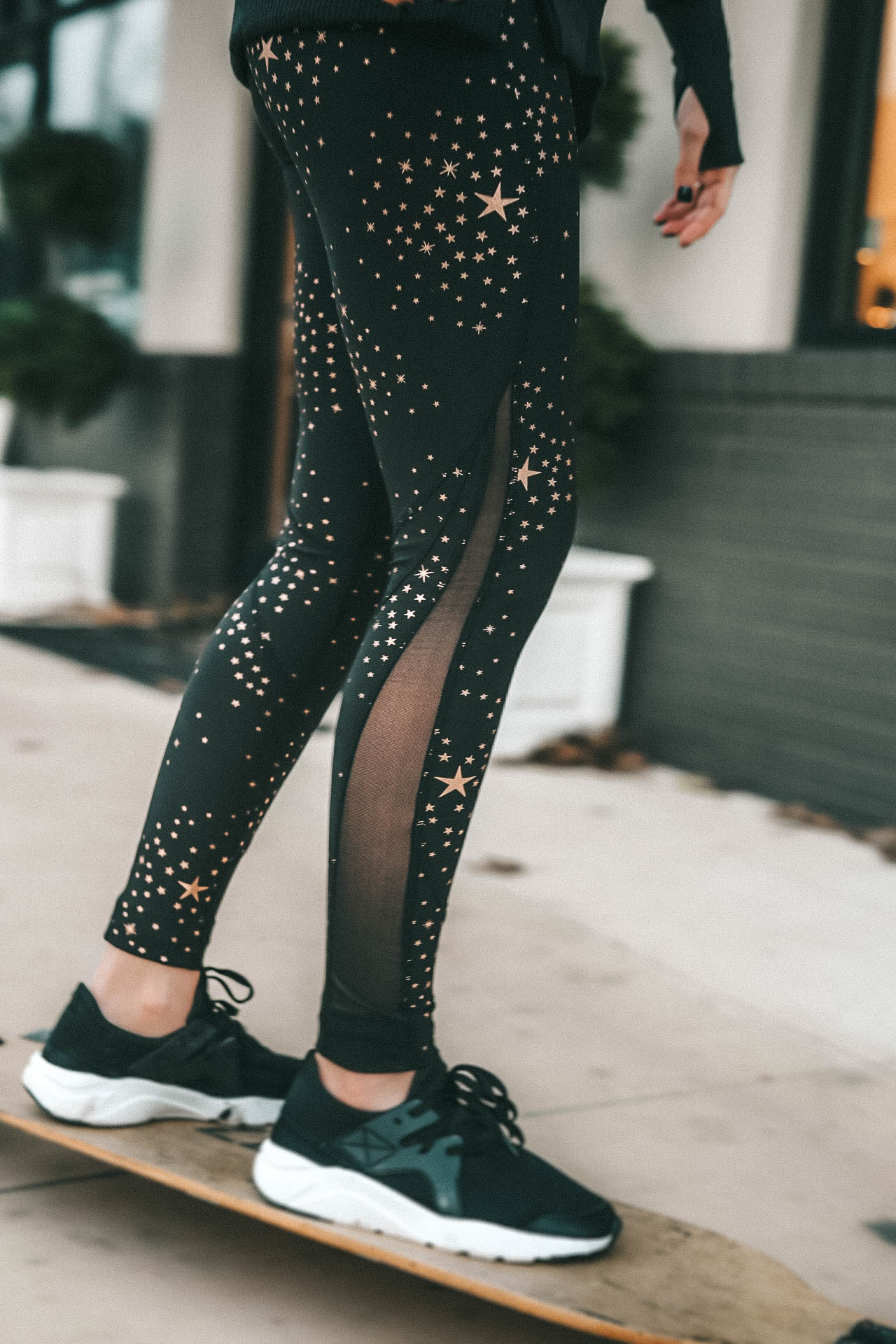 Affordable Activewear featured by top US fashion blog Dressed to Kill; Women wearing Walmart workout legging riding a long board.
