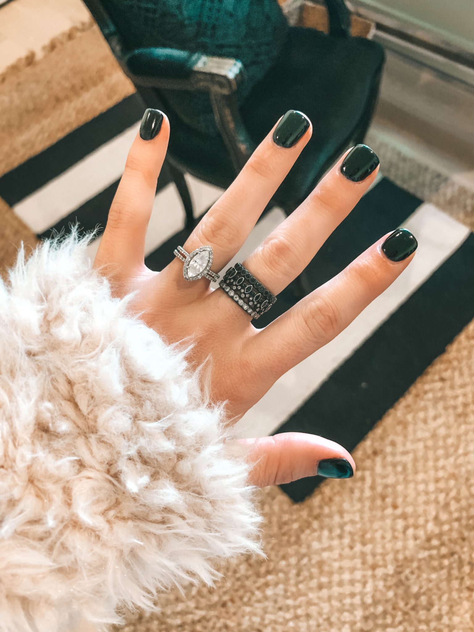 How to Wear Armenta Stackable Rings by popular Austin fashion blog, Dressed to Kill: image a woman's hand with and Armenta stackable ring set on it.
