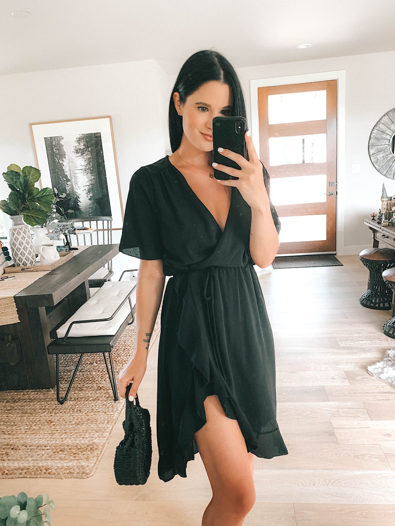 5 Affordable Summer Outfits from Walmart by popular Austin fashion blog, Dressed to Kill: image of a woman standing inside and wearing a black LA Gypsy Women's Midi Front Ruffled Dress.
