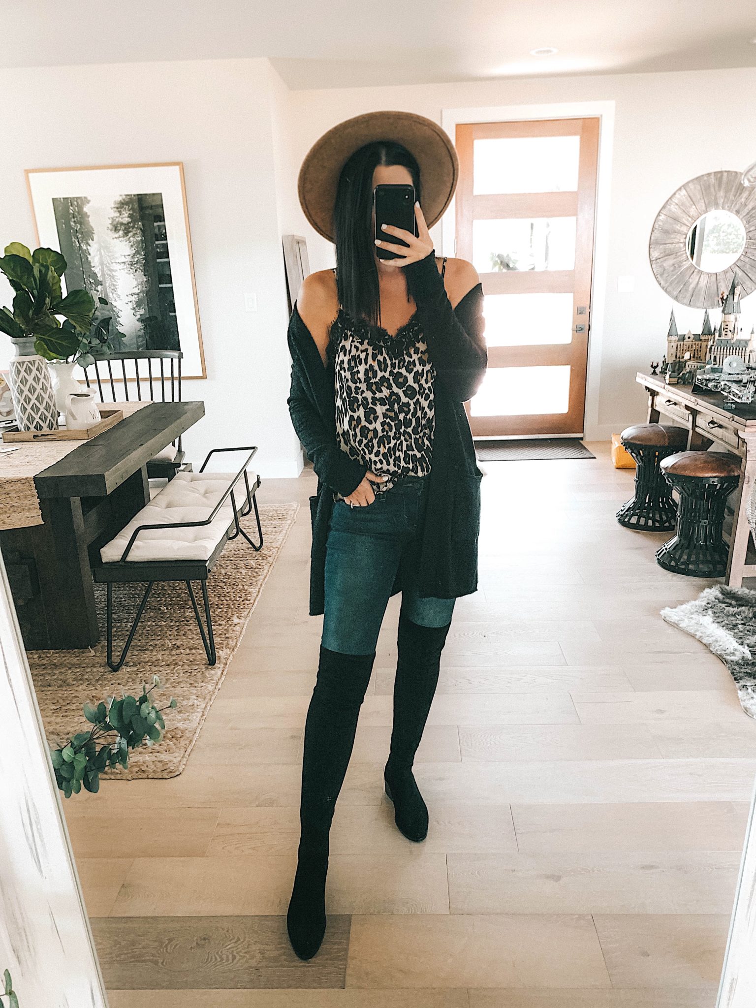 Create a Capsule Wardrobe with Nordstrom Anniversary Sale Pieces by popular Austin fashion blog, Dressed to Kill: image of a woman standing in her house and wearing a Nordstrom Free People Oversized Tunic and Steve Madden Over the Knee Boots
