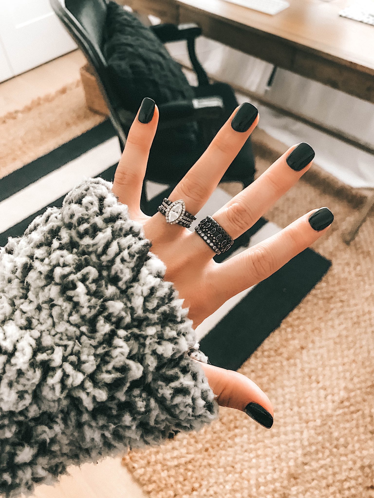How to Wear Armenta Stackable Rings by popular Austin fashion blog, Dressed to Kill: image a woman's hand with and Armenta stackable ring set on it.