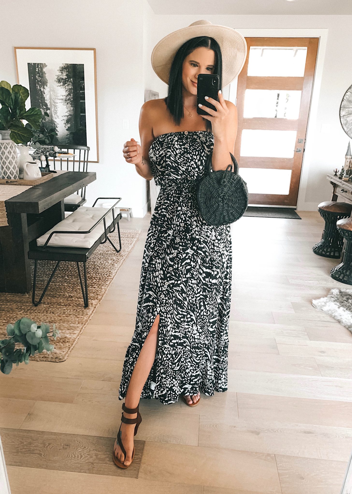 7 Affordable Fall Outfits from Walmart by popular Austin fashion blog, Dressed to Kill: image of a woman standing inside her house and wearing a Walmart Sofia Jeans By Sofia Vergara Strapless Maxi Dress.