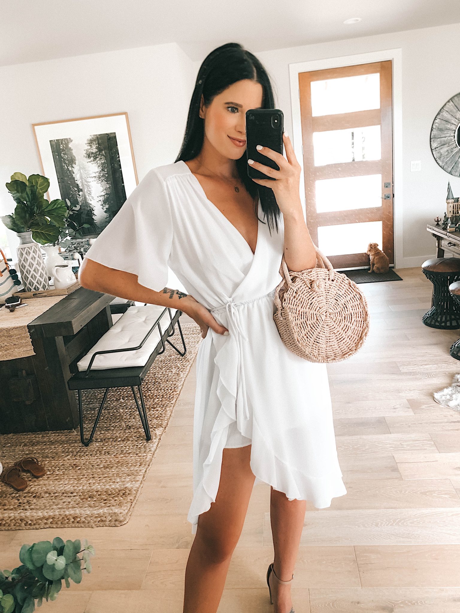 5 Affordable Summer Outfits from Walmart by popular Austin fashion blog, Dressed to Kill: image of a woman standing inside and wearing a white LA Gypsy Women's Midi Front Ruffled Dress.