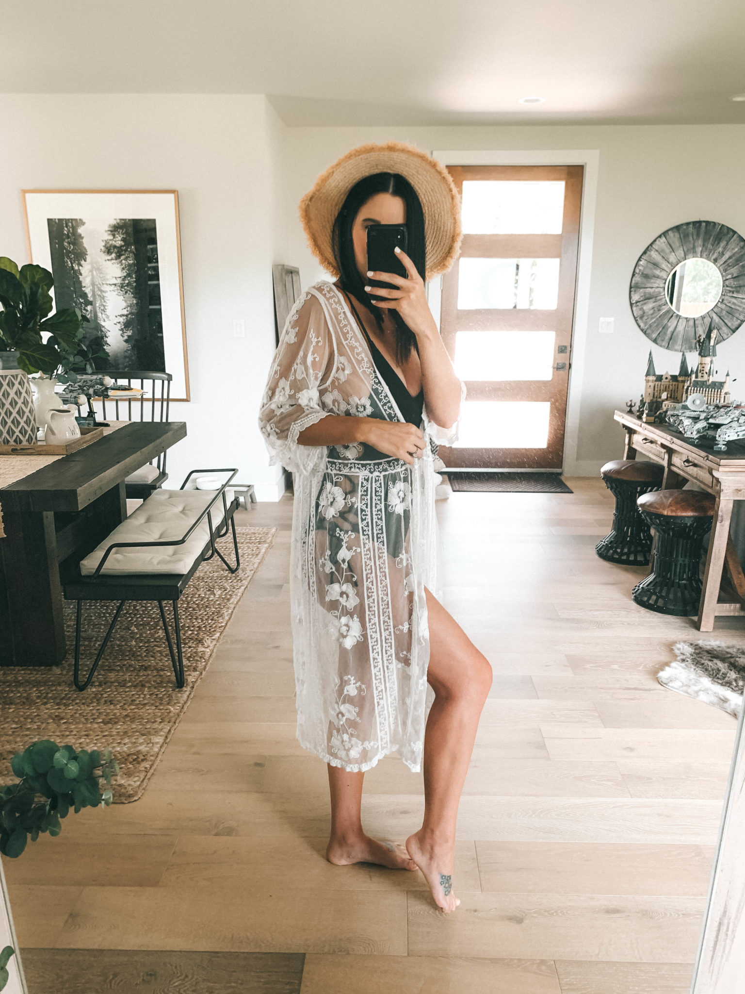 Amaryllis Apparel Abroad Turks & Caicos Summer Try-On by popular Austin fashion blog, Dressed to Kill: image of a woman wearing an Amaryllis Apparel black lace up one piece and white Amaryllis Apparel Camellia Kimono.