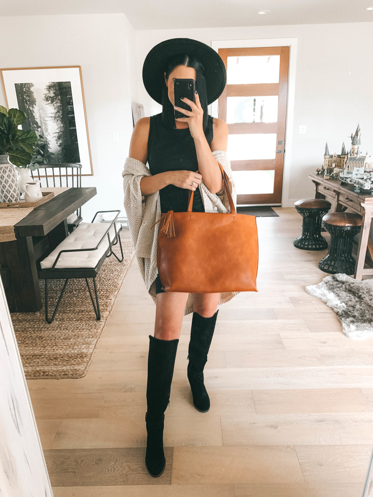 Must Have Sole Society Fall Staples by popular Austin fashion blog, Dressed to Kill: image of a woman wearing a black Nordstrom Leith rouched body-con dress, Sole Society Paloma wedge boot, Sole Society Knit Detail Wrap, and holding a Sole Society Wallis Tote. 