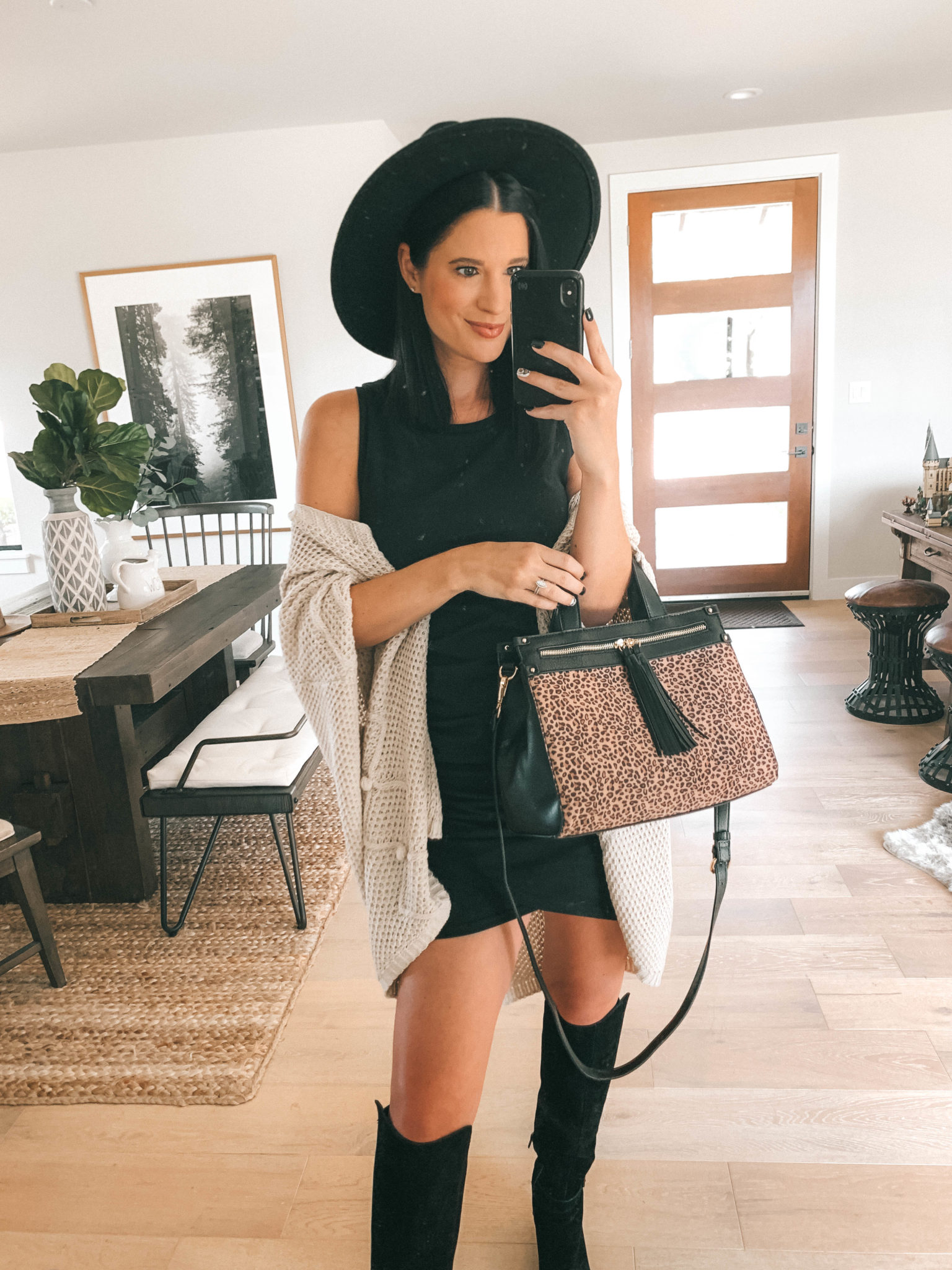 Must Have Sole Society Fall Staples by popular Austin fashion blog, Dressed to Kill: image of a woman wearing a black Nordstrom Leith rouched body-con dress, Sole Society Paloma wedge boot, Sole Society Knit Detail Wrap, and holding a Sole Society leopard print Zypa Satchel. 