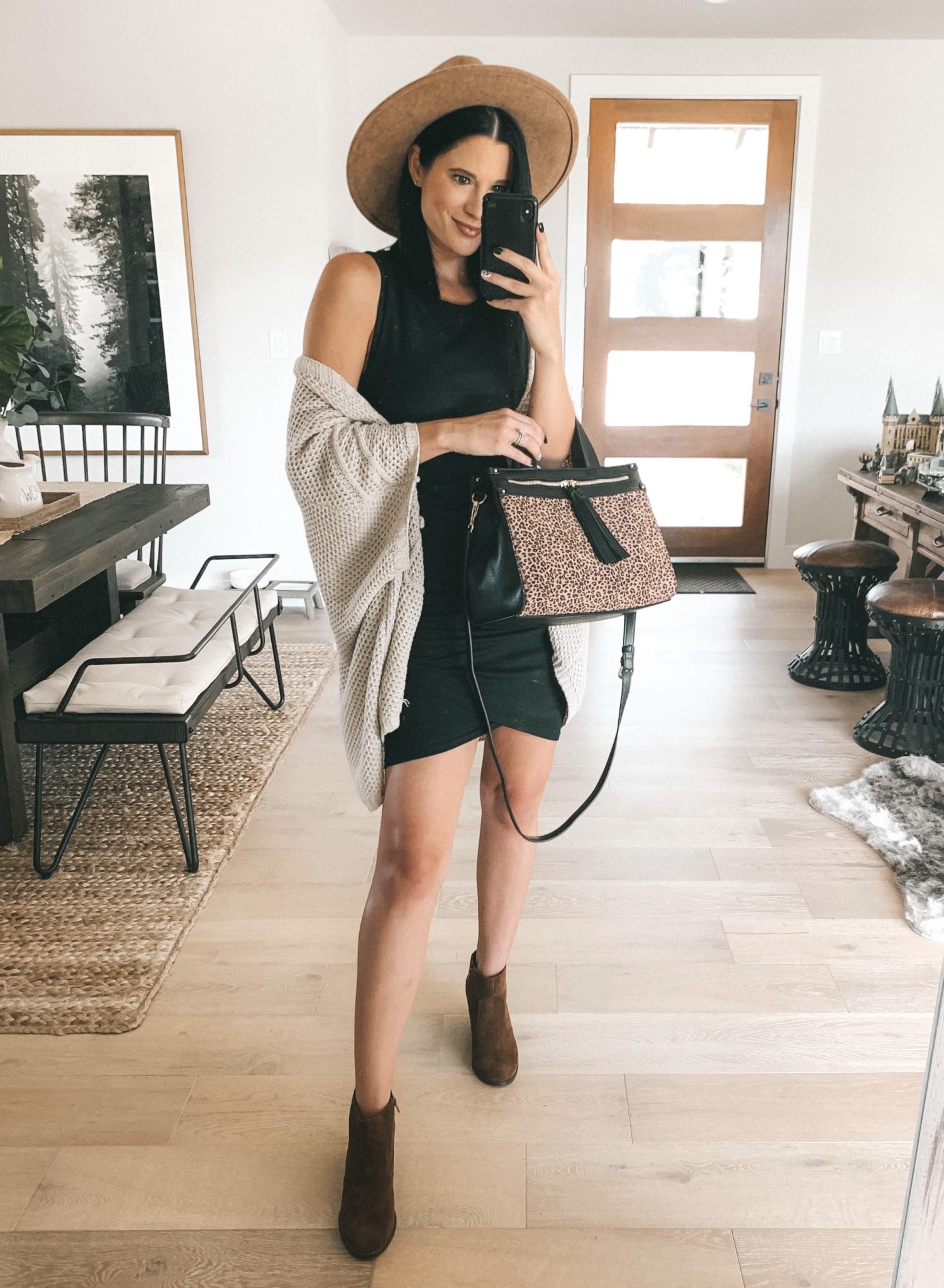Must Have Sole Society Fall Staples by popular Austin fashion blog, Dressed to Kill: image of a woman wearing a black Nordstrom white Leith dress, Sole Society Knit Detail Wrap, Patsy Wedge Bootie and holding a leopard print Zypa Satchel bag.