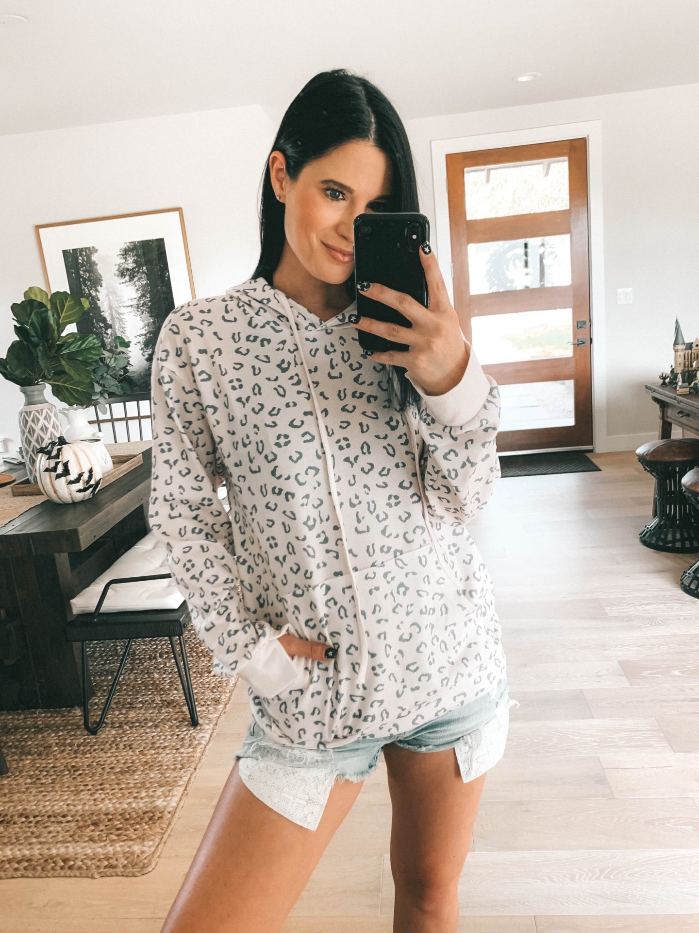 Must Have Staples From the Goodnight Macaroon Fall Collection by popular Austin fashion blog, Dressed to Kill: image of a woman wearing a Goodnight Macaroon 'ARMIN' LEOPARD PRINT HOODIE.