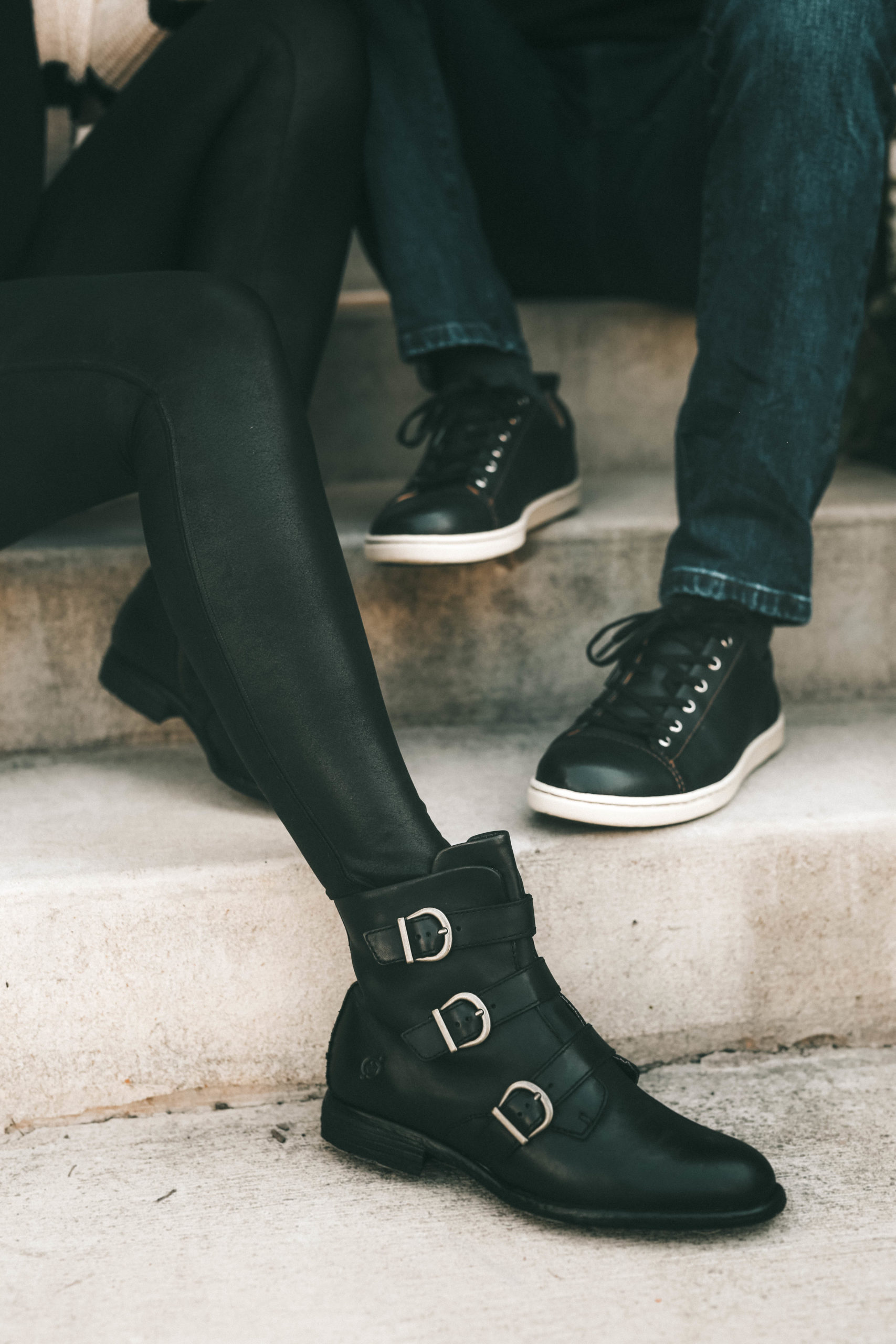 Must Have Cute Fall Shoes for Him & Her by popular Austin fashion blog, Dressed to Kill: image of a man and woman wearing Zappos Born Nivine ankle boots and Zappos Born Allegheny sneakers.