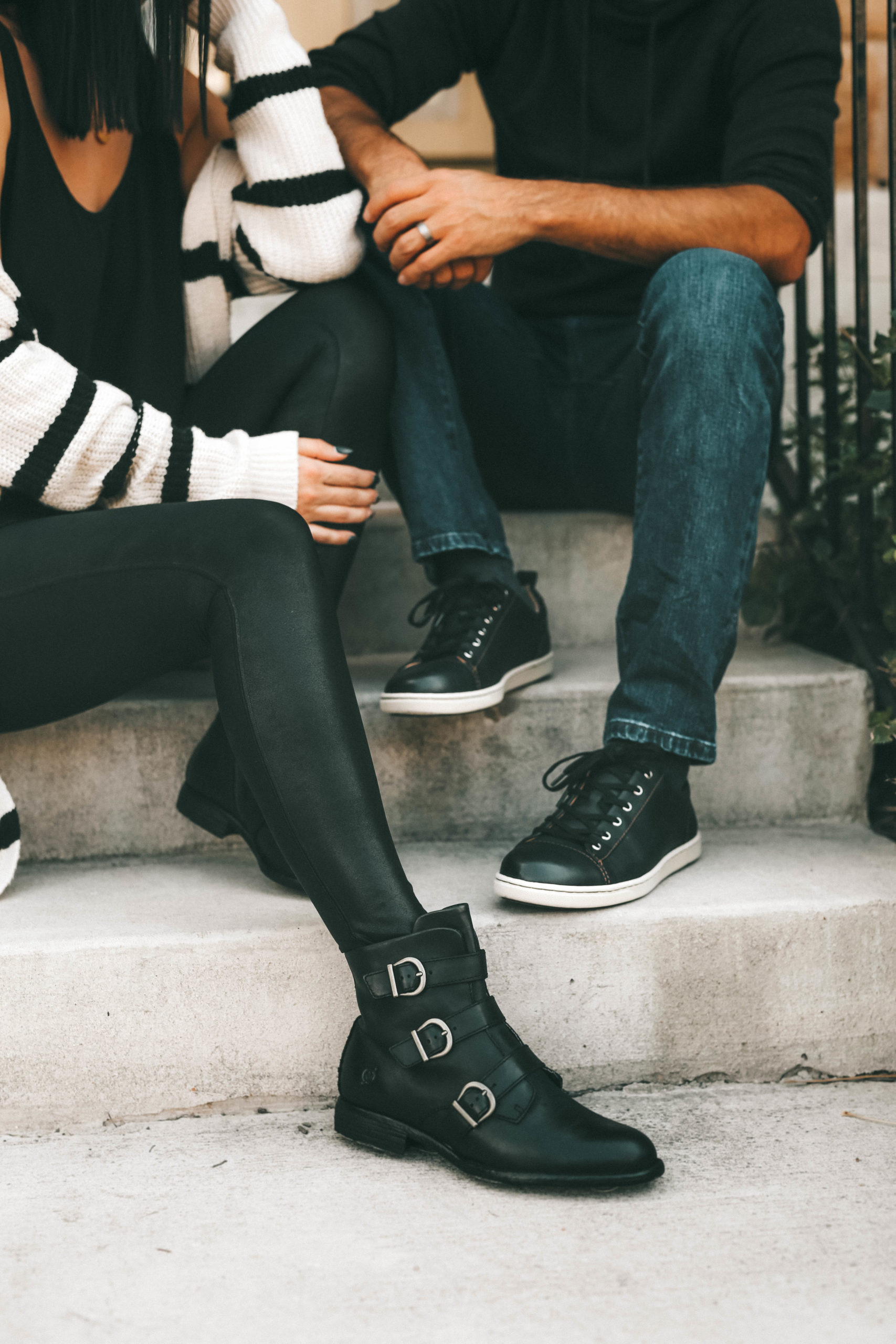 Must Have Cute Fall Shoes for Him & Her by popular Austin fashion blog, Dressed to Kill: image of a man and woman wearing Zappos Born Nivine ankle boots and Zappos Born Allegheny sneakers.
