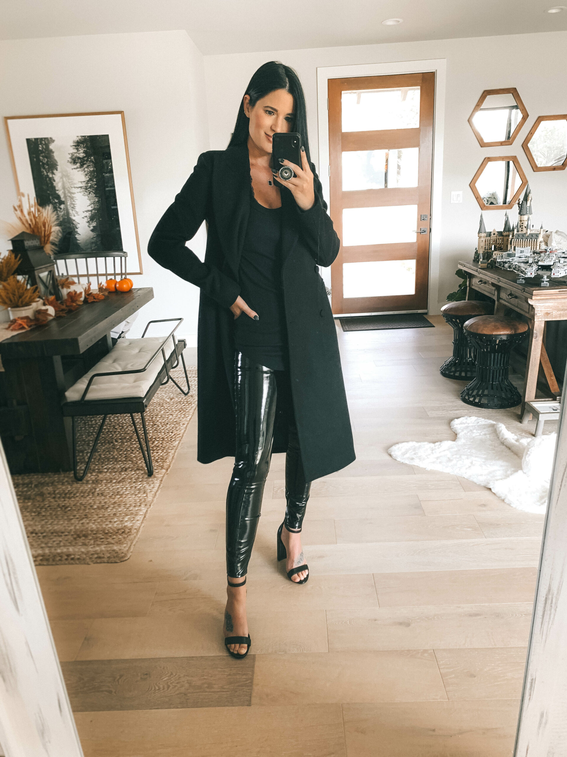 Patent Leather Leggings by popular Austin fashion blog, Dressed to Kill: image of a woman wearing a pair of Spanx Faux Patent Leather Leggings with black block heel sandals, a black blazer, and a black t-shirt. 