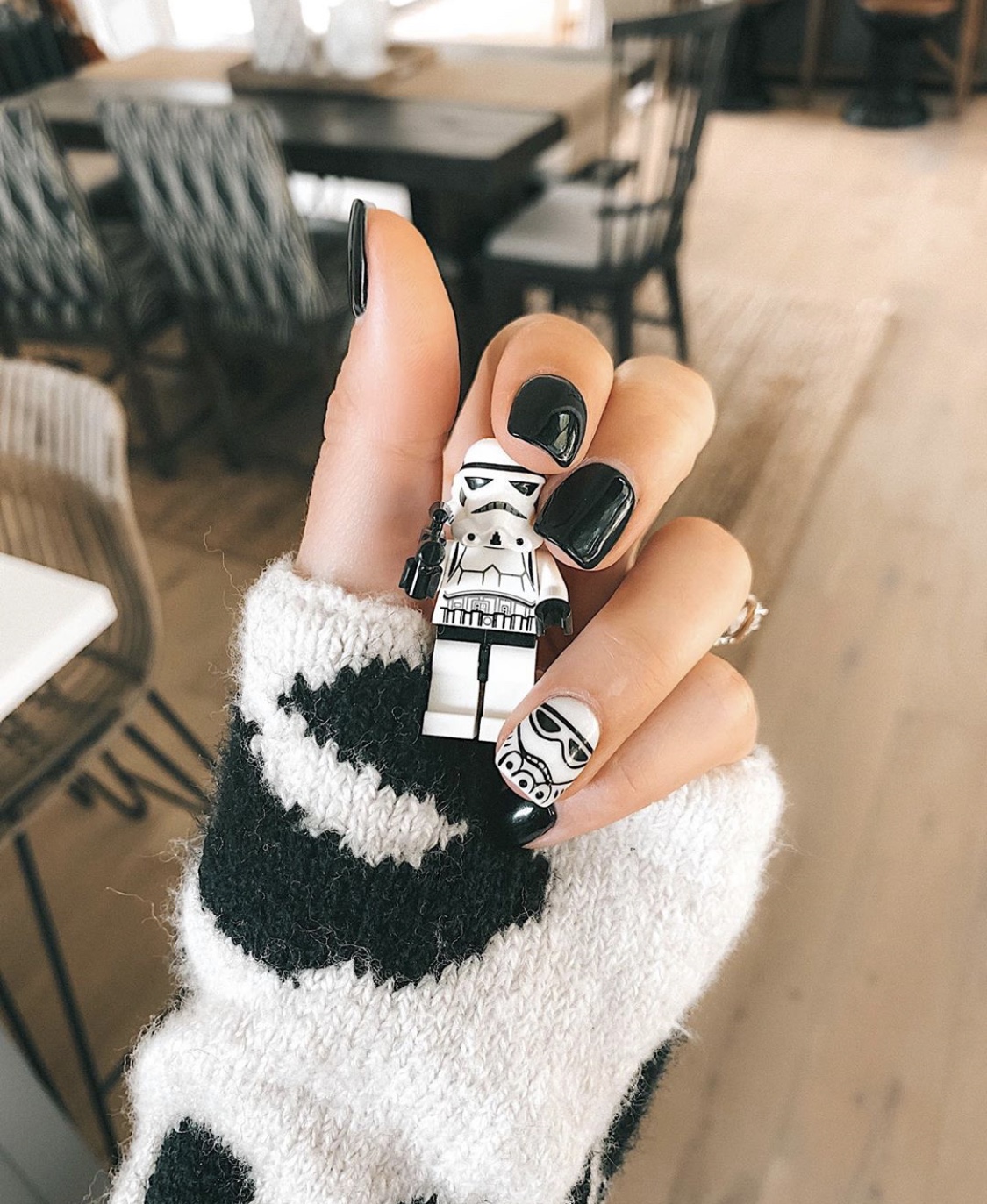 Nail Art Designs by popular Austin beauty blog, Dressed to Kill: image of a woman with Star Wars nail art. 