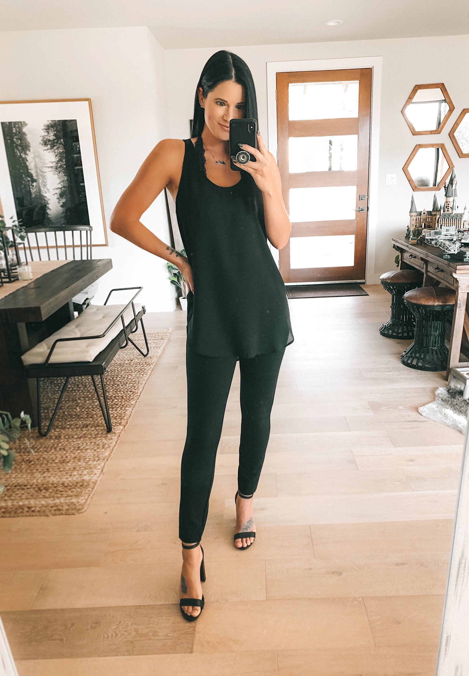 Nordstrom Anniversary Sale by popular Austin fashion blog, Dressed to Kill: image of a woman wearing a black tank top, black block heel sandals, and black faux leather leggings. 